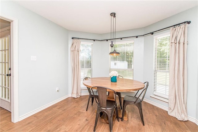 dining space with light wood-type flooring