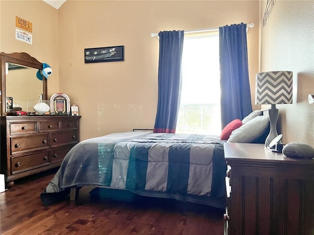 bedroom featuring dark hardwood / wood-style flooring