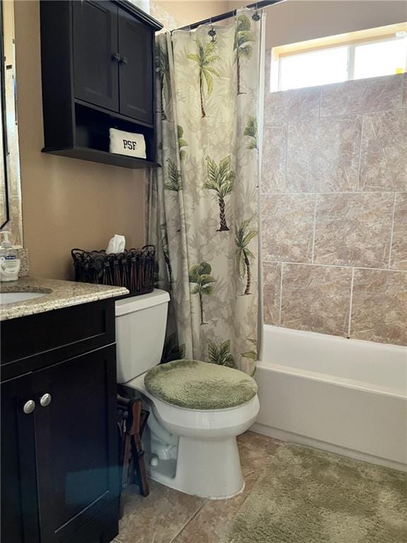 full bathroom featuring tile patterned flooring, vanity, shower / tub combo, and toilet