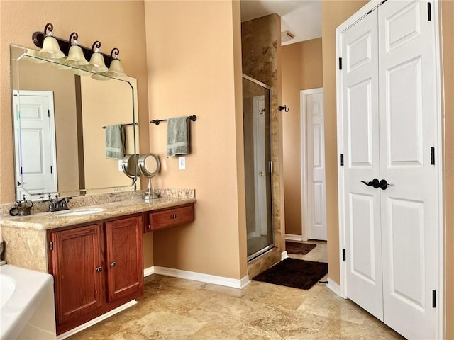 bathroom featuring vanity and a shower with shower door