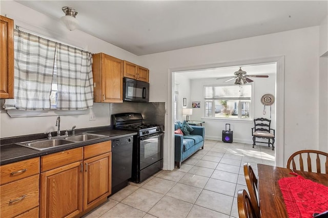 kitchen with light tile patterned floors, sink, ceiling fan, and black appliances