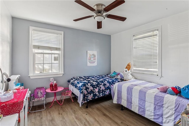 bedroom featuring hardwood / wood-style floors and ceiling fan