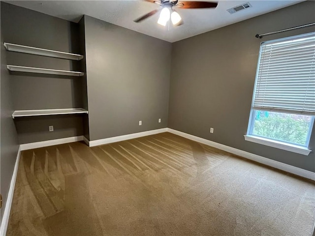 unfurnished bedroom featuring carpet, ceiling fan, and a closet