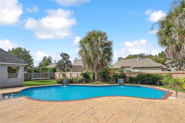 view of pool featuring pool water feature and a patio area