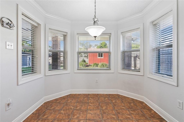 unfurnished room with crown molding and dark tile patterned flooring