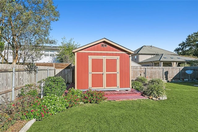 view of outbuilding with a lawn