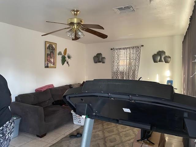 misc room featuring ceiling fan and light tile patterned floors