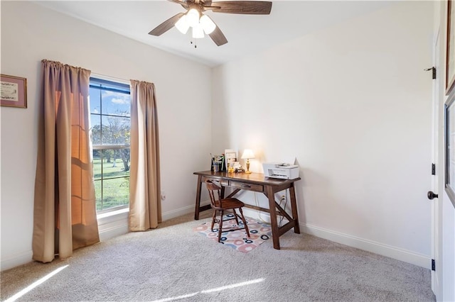 office featuring light carpet and ceiling fan