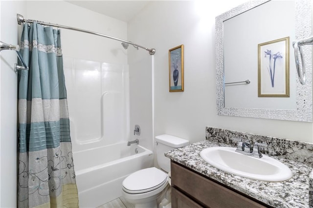 full bathroom with vanity, toilet, and shower / bath combo with shower curtain