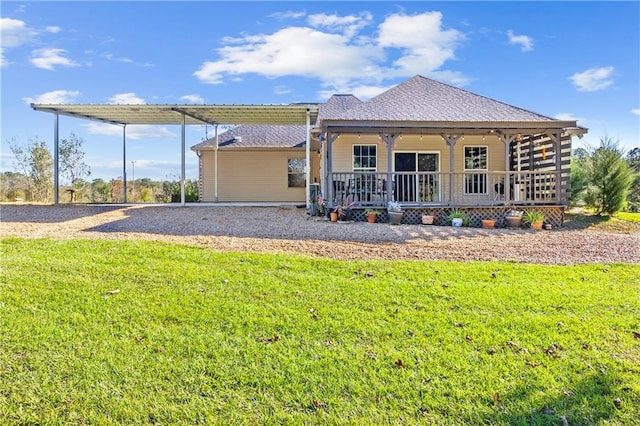 back of house featuring a porch and a lawn