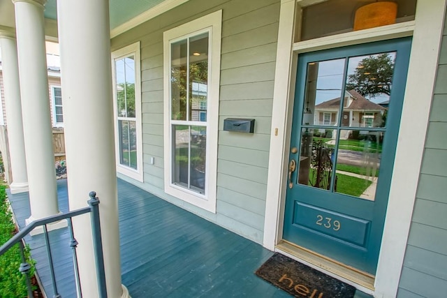 doorway to property featuring covered porch