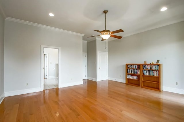 unfurnished room featuring crown molding, light hardwood / wood-style flooring, and ceiling fan