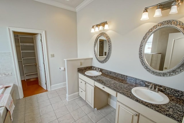 bathroom featuring ornamental molding, vanity, and tile patterned floors