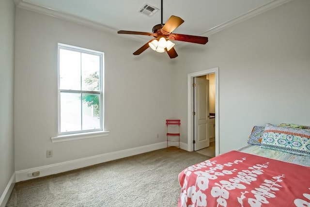 bedroom with ornamental molding, carpet, and ceiling fan