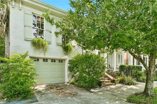 obstructed view of property featuring a garage