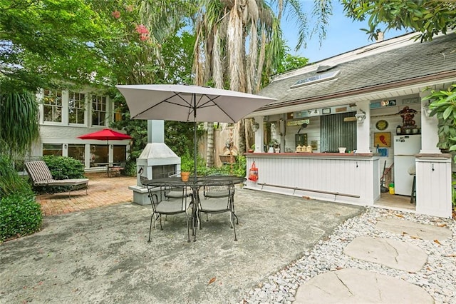 view of patio / terrace featuring a fireplace