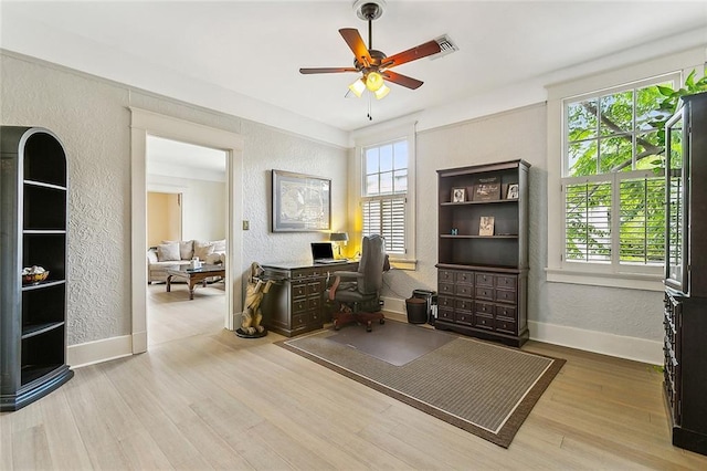 home office with ceiling fan and light wood-type flooring