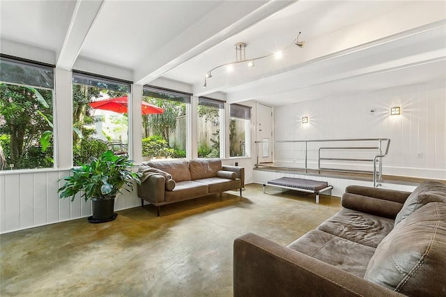 sunroom featuring beamed ceiling