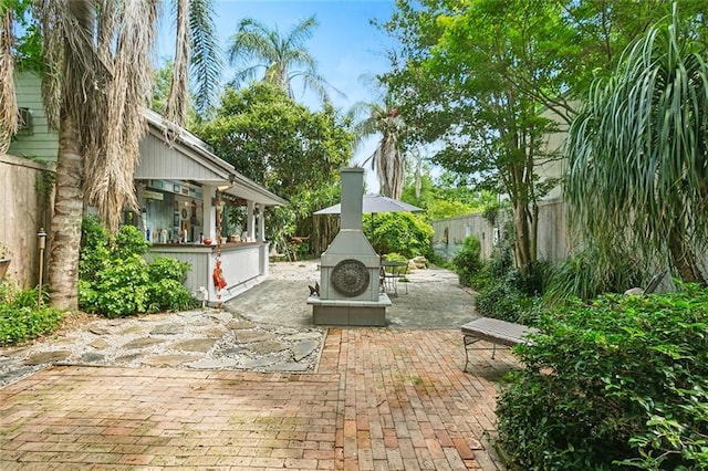 view of patio / terrace with exterior fireplace