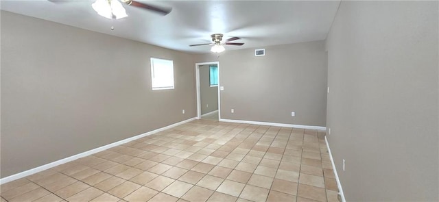 unfurnished room featuring ceiling fan and light tile patterned floors