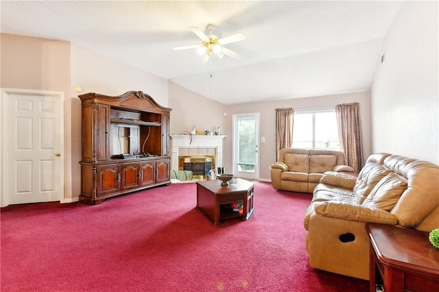 carpeted living room featuring ceiling fan and vaulted ceiling