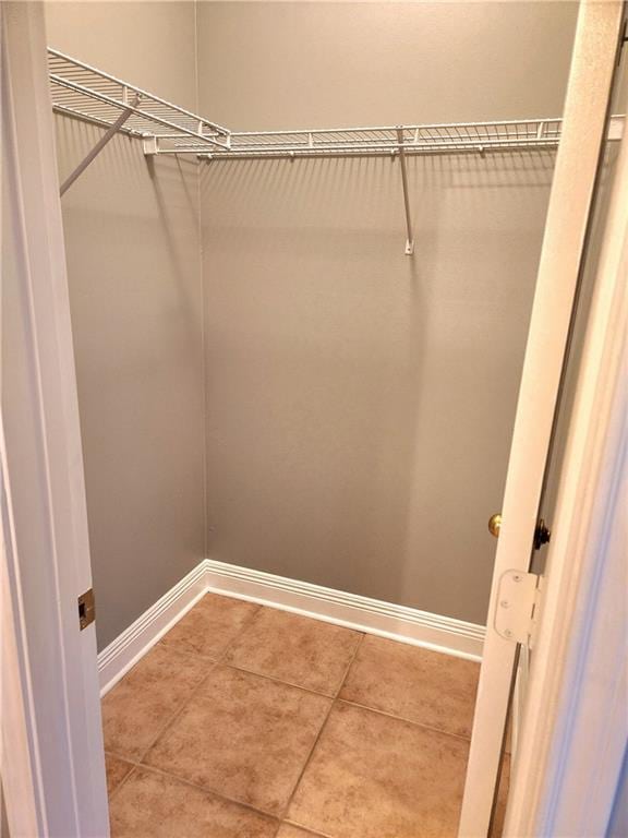 walk in closet featuring tile patterned floors