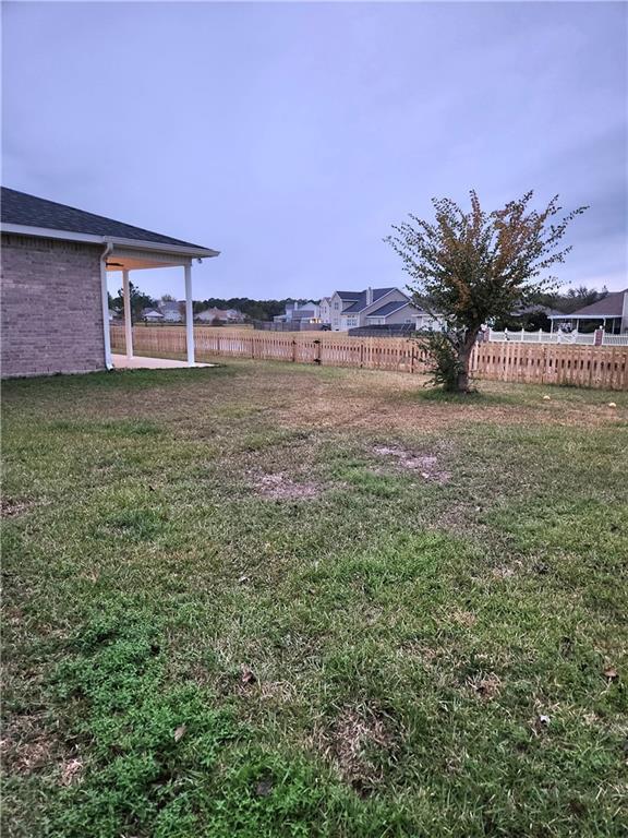 view of yard with fence