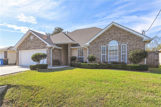 view of front facade with a garage and a front lawn