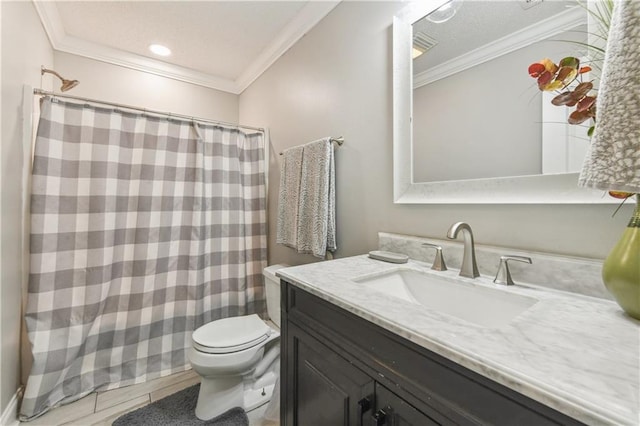 bathroom featuring a shower with curtain, toilet, vanity, and ornamental molding