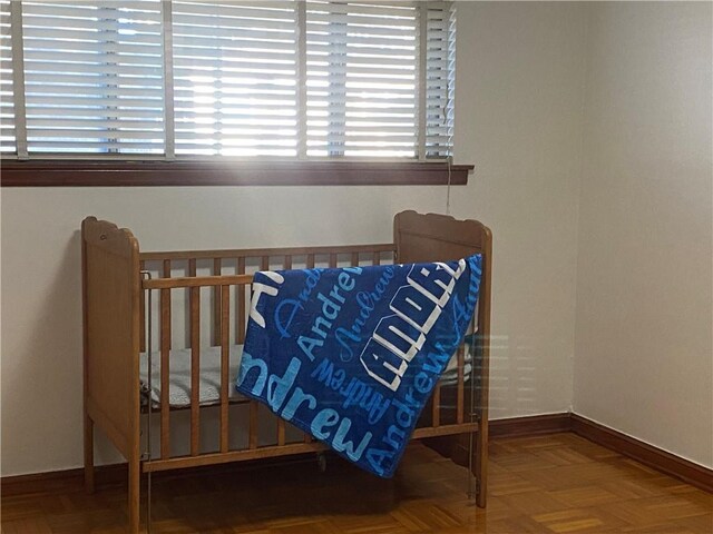 bedroom with parquet flooring