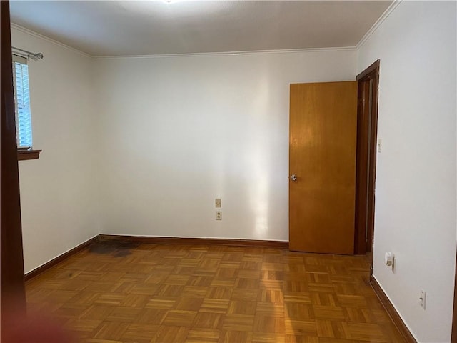 empty room with crown molding and parquet flooring