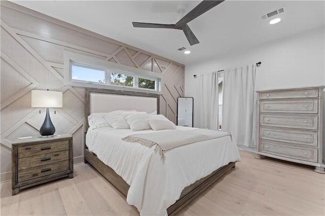 bedroom featuring ceiling fan and light hardwood / wood-style flooring