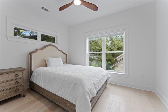 bedroom featuring light hardwood / wood-style flooring and ceiling fan