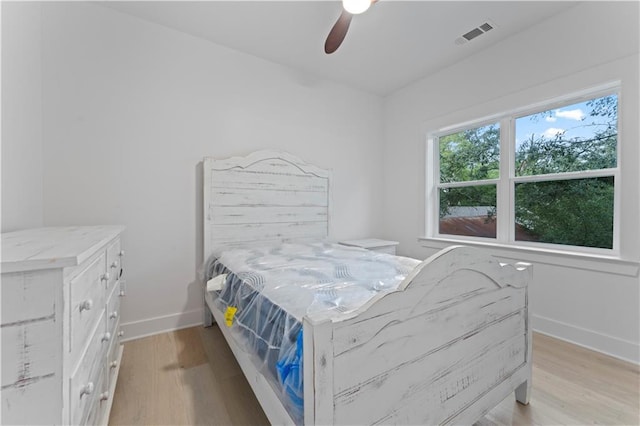 bedroom featuring ceiling fan and light hardwood / wood-style flooring