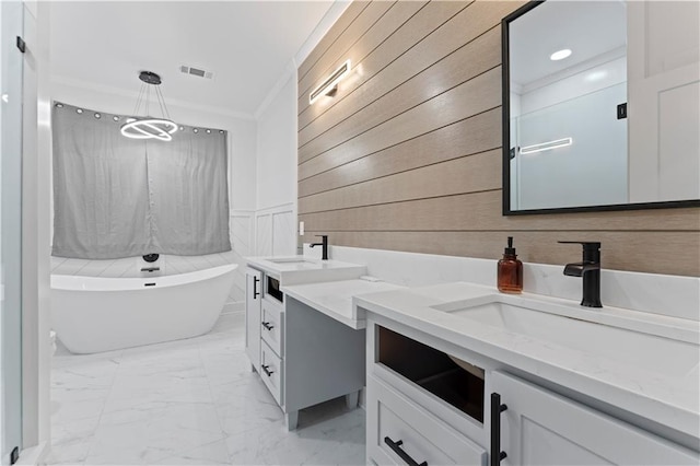 bathroom featuring wooden walls, a washtub, vanity, and ornamental molding