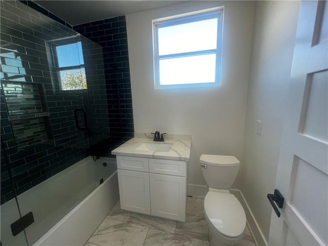 full bathroom featuring toilet, vanity, and tiled shower / bath combo