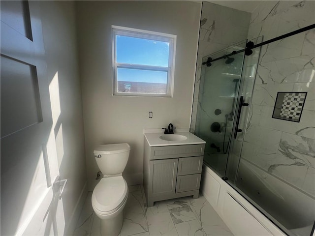 full bathroom featuring vanity, toilet, and bath / shower combo with glass door