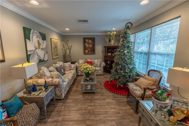 living room featuring hardwood / wood-style flooring and crown molding