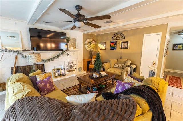 tiled living room featuring beamed ceiling and ceiling fan