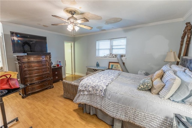 bedroom with ceiling fan, crown molding, and light hardwood / wood-style flooring