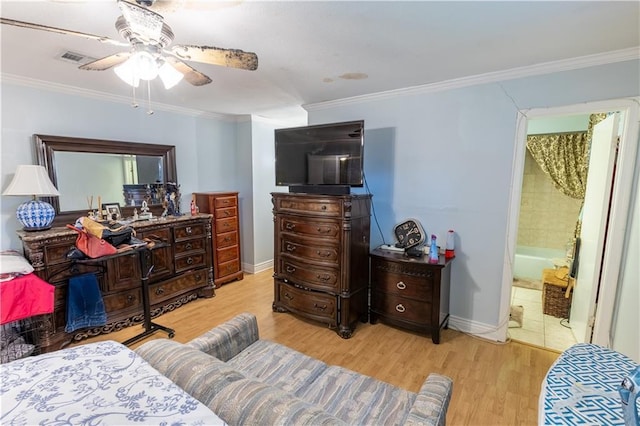 bedroom with ensuite bathroom, ceiling fan, crown molding, and light hardwood / wood-style flooring