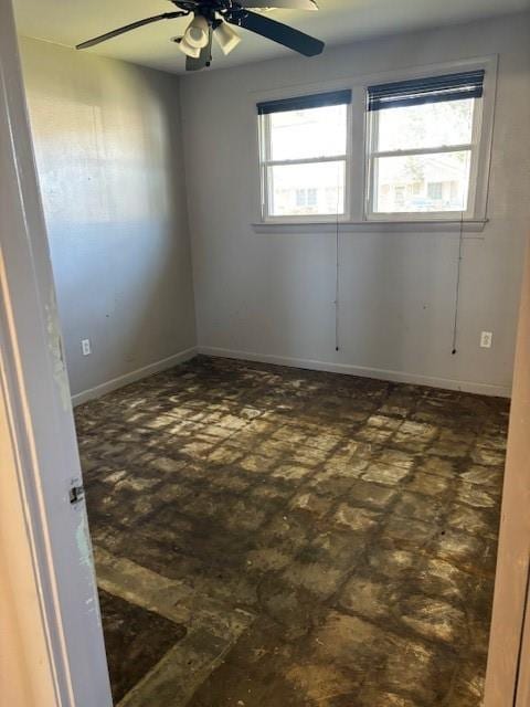 spare room featuring a wealth of natural light and ceiling fan