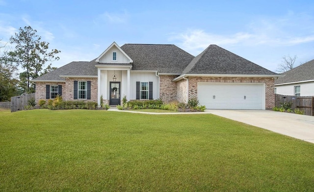 view of front of home featuring a front lawn and a garage