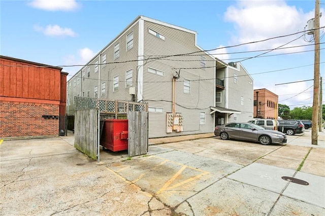 view of outbuilding featuring uncovered parking