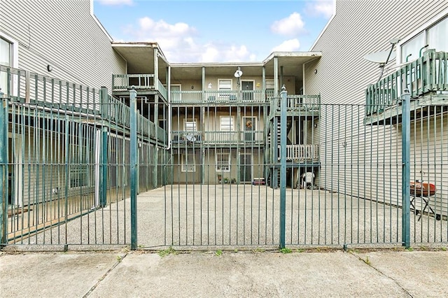 view of gate featuring a fenced front yard