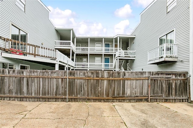 view of home's community with fence