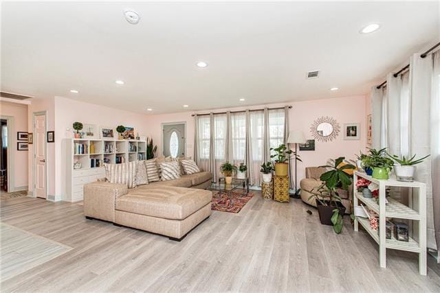 living room with light hardwood / wood-style flooring