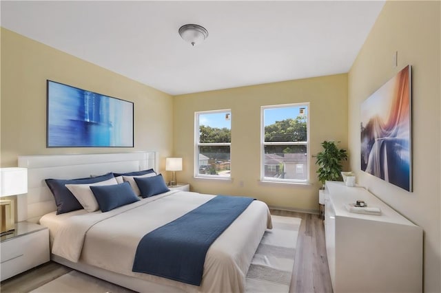 bedroom with light hardwood / wood-style floors