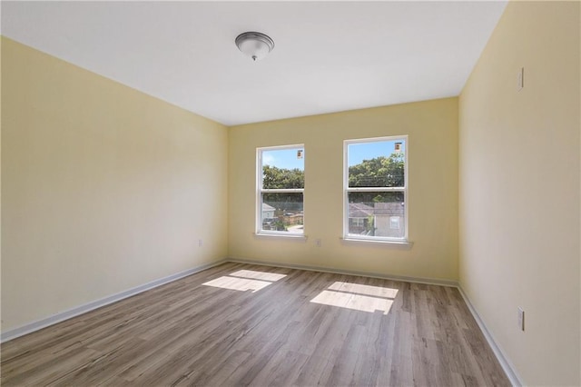 unfurnished room featuring light hardwood / wood-style flooring