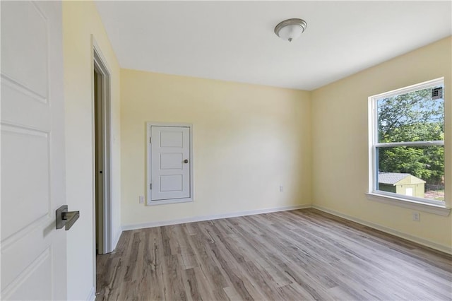 spare room featuring light hardwood / wood-style flooring